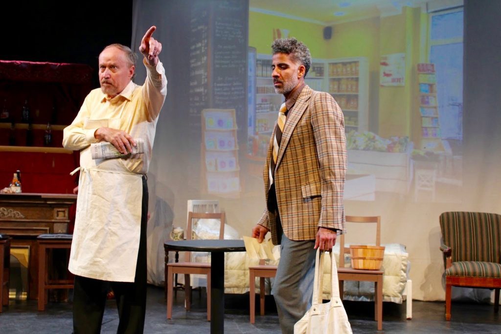 Salem suffers the indignity of being shown the door of shopkeeper Herr Gruber played to a vicious Nazi turn by Colin Davies.