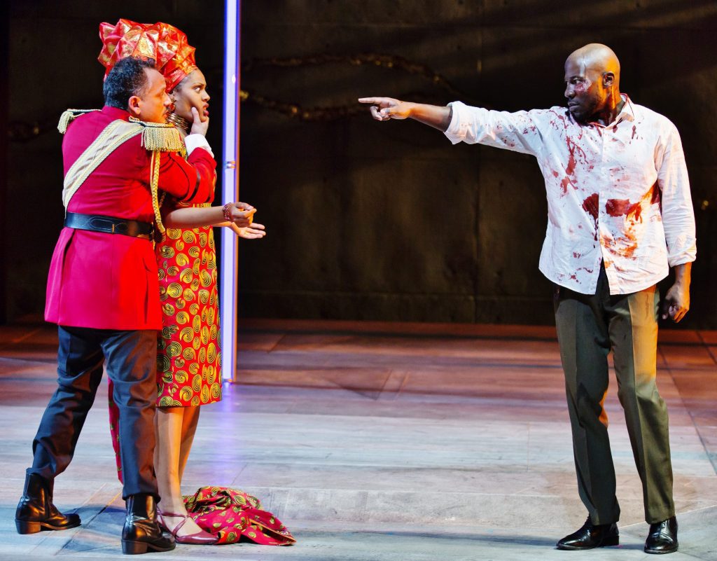 The bloody ghost of Banquo played by McKinley Belcher confronts the King and Queen.