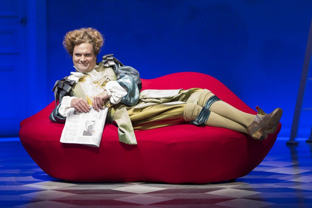Cody Nickell as the transgender Fat Cat Philinte features the powdered wig and legs stockings that Costume Designer Murell Horton nailed.