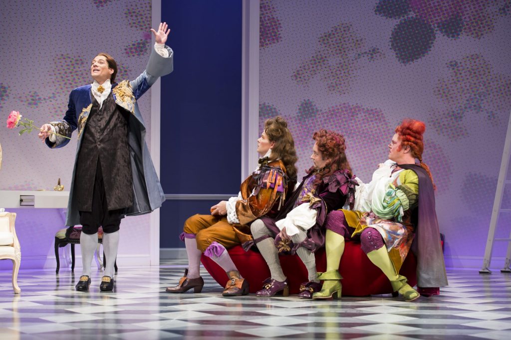 Frank becomes the Fashion Plate after falling for Celimene, as the clueles suiters, Clitander played by Cameron Folmar; Acosta, played by Liam Craig; and Oronte, played by Tom Story look on with wilderment!
